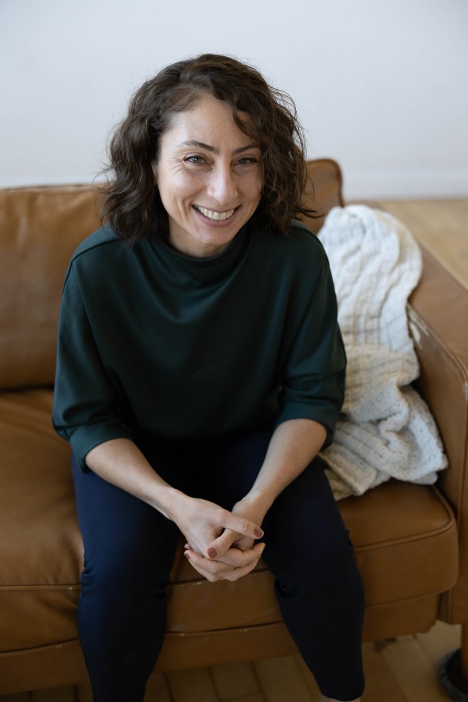 Jo seated looking at camera